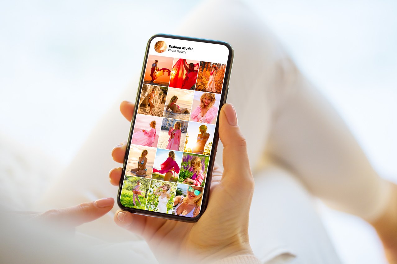 Hand Holding Cellphone Showing Social Media Photos